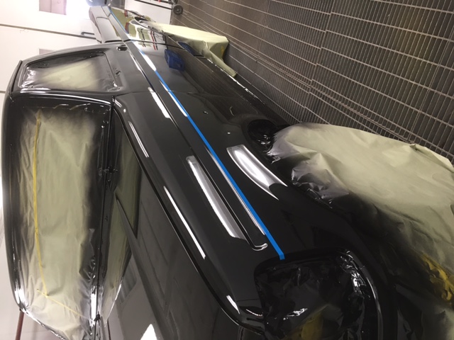 After: Ford F150 bed side in deep black finish with blue line tape laid out