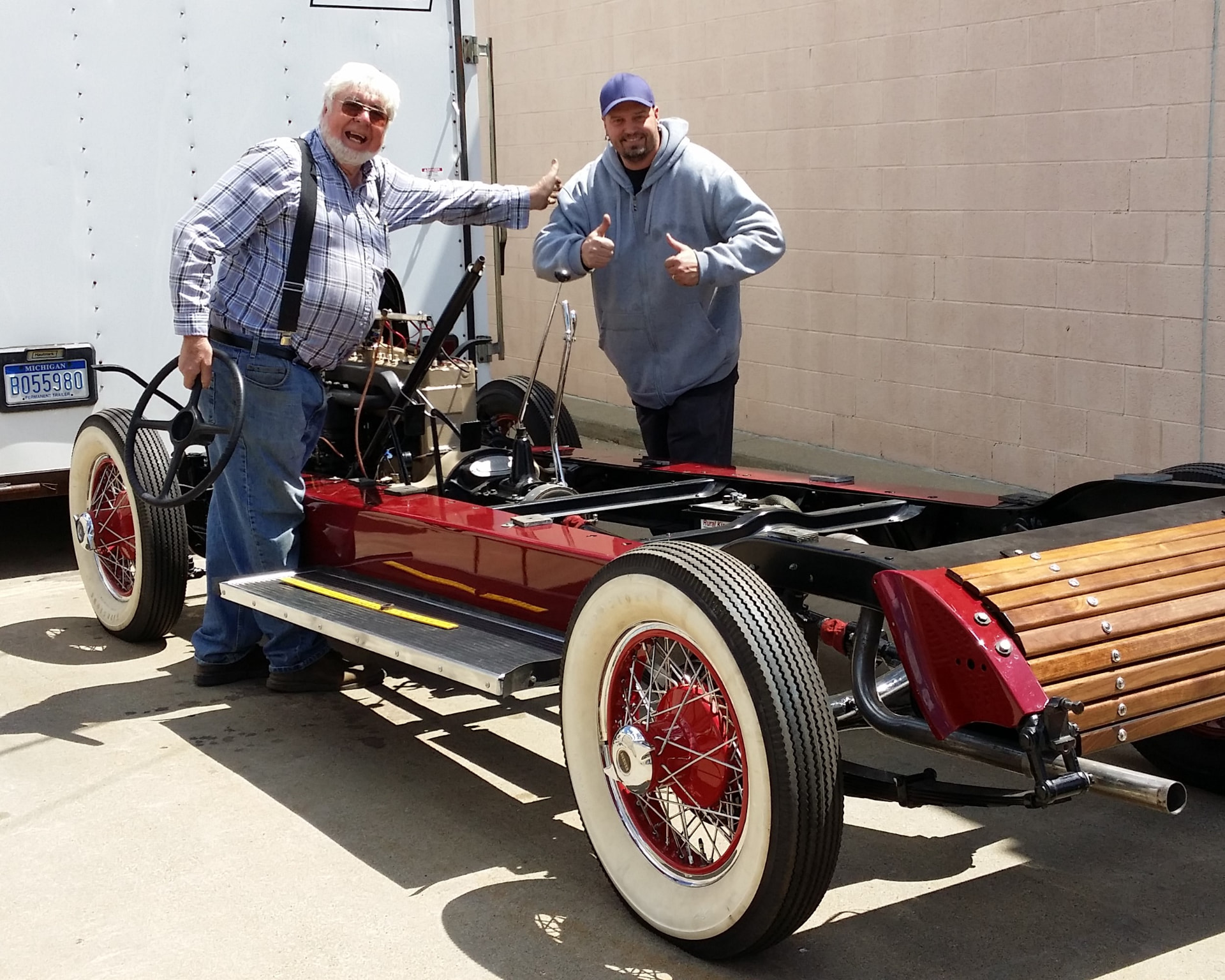 After: Eric and the Auburn's owner giving thumbs up beside the finished chassis at delivery