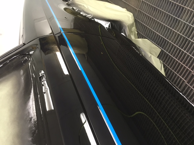 After: close-up of the Ford F150 black hood and cowl with crisp accent line