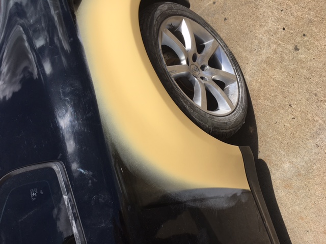 After: repaired Infiniti quarter panel smoothed and ready for final finish