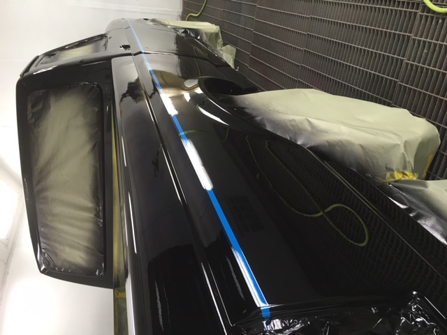 After: Ford F150 cab roof and bed in deep black gloss with blue accent line