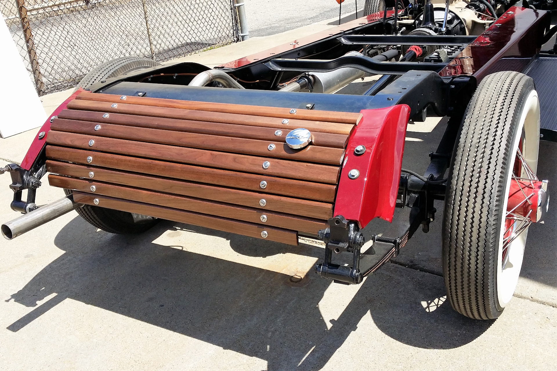 During: hand-built walnut wood gas tank cover mounted on the Auburn frame